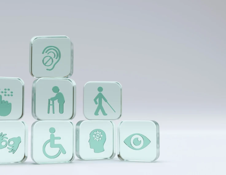 Iconos de accesibilidad en bloques translúcidos representando diferentes tipos de discapacidad: visual, auditiva, motora y cognitiva